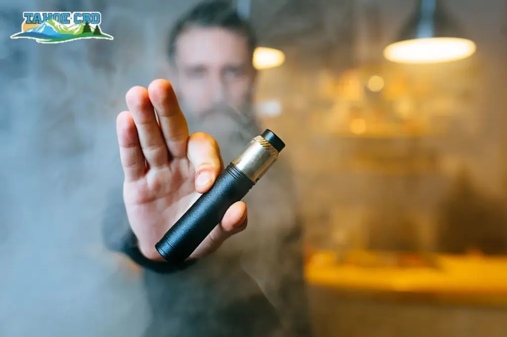Man vaping outdoors—“Woman vaping CBD outside in Augusta”